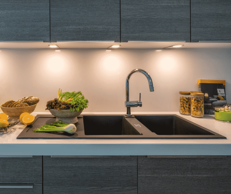 A Quick Household Check Helps Conserve Resources sink with fresh vegetables on counter