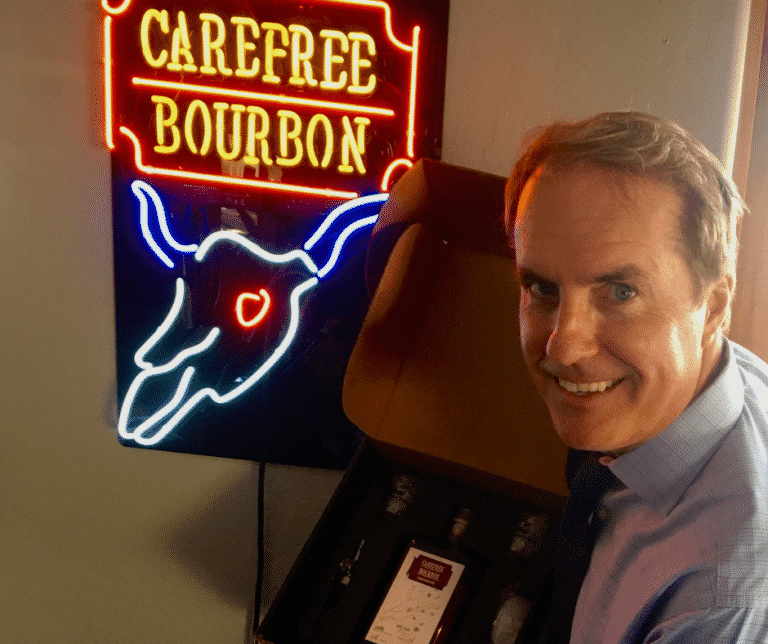 August Greeting From Darrell Darrell next to Carefree Bourbon LED light