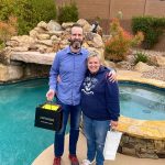 Katie and Don in front of their new pool